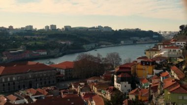 Aerial view of the old city with promenade of the Douro river. Amazing Porto in Portugal, Douro River, Old Town, Oporto. Coastal Northern City. Traditional bridge, famous travel destination 