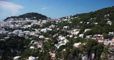 Beautiful coastline in Marina Piccola beach, Capri. Capri town with sunshine Italy. White town along the Amalfi Coast Near Salerno. Colorful And Charming Historical Architecture. Beach and Blue Ocean.