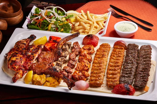 Spicy Bbq Mixed Grills Platter Tikka Boti Kababs Fries Salad — Stock Photo, Image