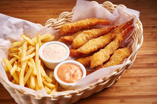 Fried Prawns with Chips and mayo dip served in basket isolated on table side view of middle east food