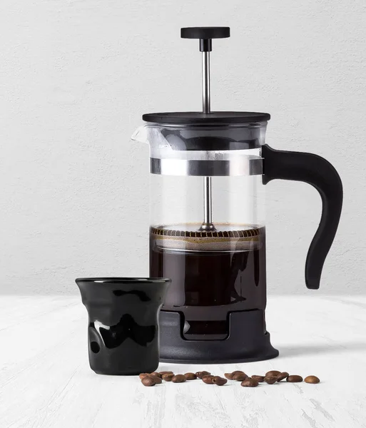 FRENCH PRESS COFFEE maker with black coffee cup isolated on background side view