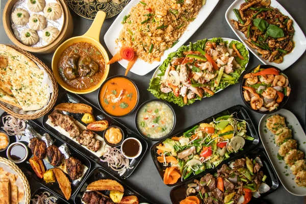 Stock image Assorted south indian food, Mutton Brain Masala, Chicken Tangdi, Chicken Reshmi tikka, Chicken karahi, Beef Nehari , Beef Bihari kabab, Beef tikka Boti, Garlic Naan aand lachha paratha isolated