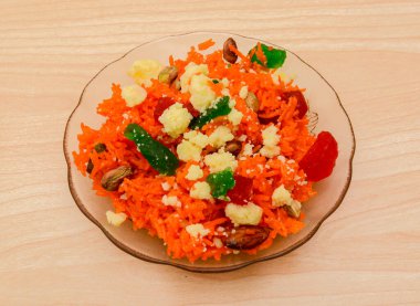 zarda or jorda rice with almond, khya and nuts served in dish isolated on table top view indian sweet food clipart
