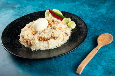 spicy Egg pulao, polao, biryani, mandi, kacchi with egg and salad served in dish isolated on table top view of indian food