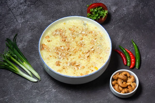 Special Chicken Corn Soup with nuts served in bowl isolated on grey background top view of indian and bangladesh food