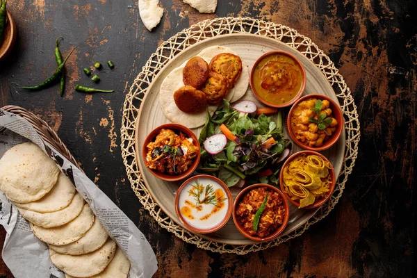 stock image Bahraini Breakfast set with hummus, raita, salad, gravy, vegetable and bread served in dish isolated on table top view of arabic breakfast