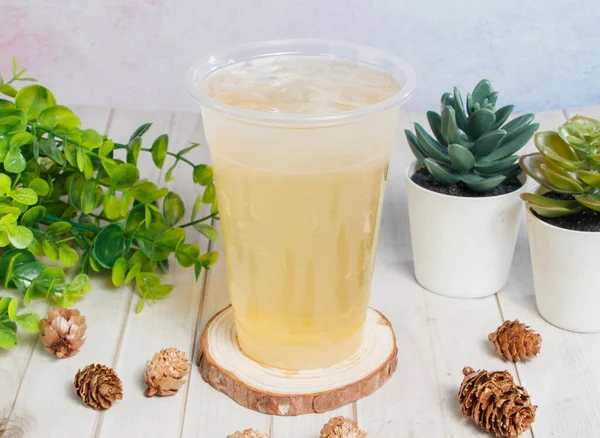 Lemon Honey Ice Tea Served Disposable Glass Isolated Wooden Board — Stock Photo, Image