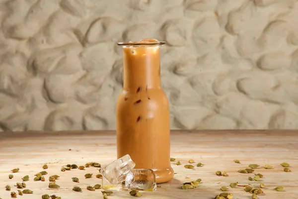 Arabic Style fresh Ice karak with Green Cardamom served in jar isolated on background top view drink