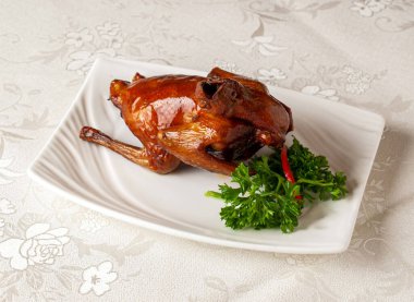 braised bbq pigeon served dish isolated on background top view of hong kong chinese food clipart