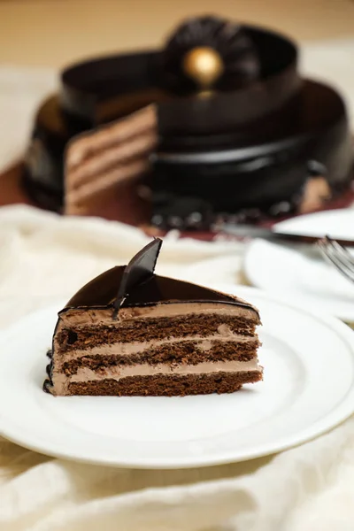 Black Forest Cake slice include chocolate chip, fork, sugar baked served in plate isolated on table side view bake cafe