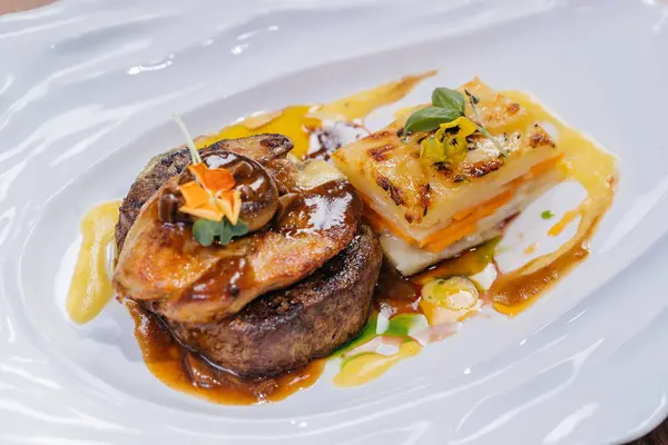 Tournedos Rossini or Tornedos served in dish isolated on table top view of meat main course arabic food