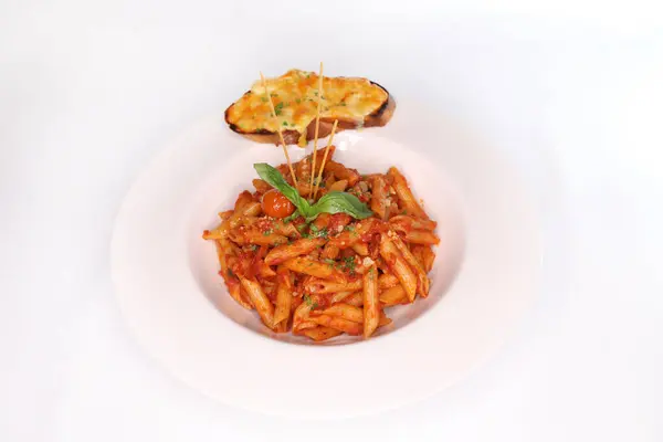 NAPOLITANA Pasta with garlic bread and tomato cherry served in dish isolated on background side view of arab food