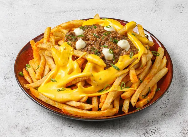 chili beet cheese fries served in dish isolated on grey background top view of singapore food