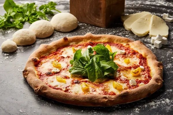 Desert Blaze Pizza isolated on dark background with raw food top view of italian fastfood appetizer