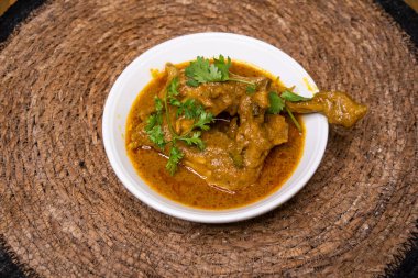 Chicken Rezala korma karahi served in dish isolated on wooden background top view indian spices, bangladeshi and pakistani food clipart