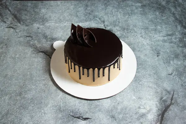 Chocolate Mocha cake served in plate isolated on background top view of baked food indian dessert