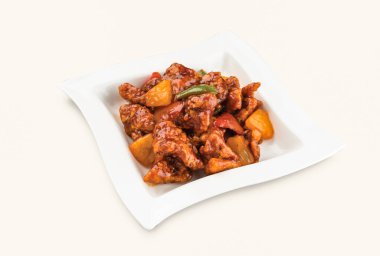 Tatlı ve Ekşi Domuz eti, Hong Kong yemeğinin gri arka planında servis edilir.