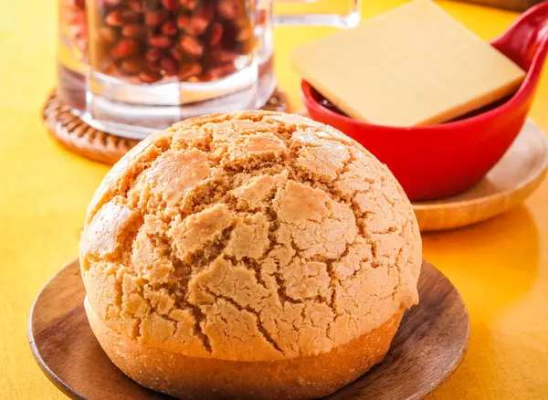 stock image Signature pineapple oil buns served on wooden board isolated on orange background side view of hong kong cafe baked food dessert