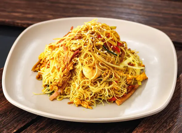 stock image Luzhou Xing zhou fried rice noodles with prawn and egg served in dish isolated on background side view of hong kong food