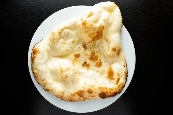 stock image Tandoori Butter Naan, nan, nun, bread or roti served in dish isolated dark background top view of indian spices, bangladeshi and pakistani food