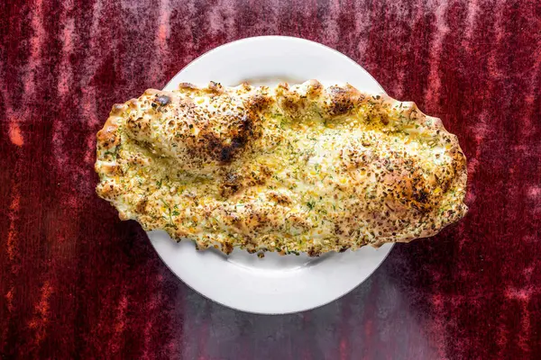 stock image Tandoori Garlic Naan or nan served in bowl isolated on table background top view of bangladeshi, indian and pakistani food