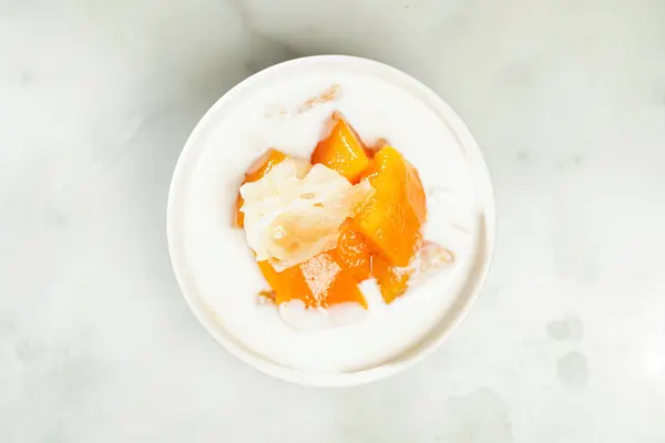 Stock image Stewed papaya with apricot juice and snow fungus served in bowl isolated on grey background top view of asian food