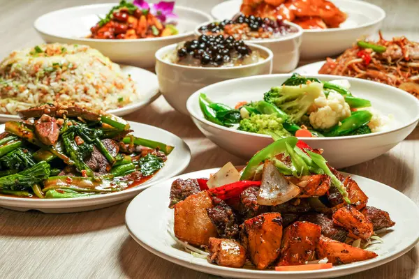 stock image Assortment Chinese food, Egg Fried Rice, Sauteed Pork Liver, mix vegetables, Stir Fried Rice Vermicelli, Sweet sour fish fillet, saliva chicken, taro balls grass jelly, Honey Lemon Aloe vera boba