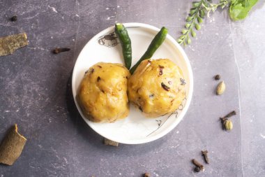 Alu bhorta or potato vorta served in plate isolated on grey background top view of bangladeshi food clipart