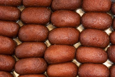 Gulab Jamun ya da Kalojam deseni Hindistan, Pakistan ve Bangladeş tatlılarının üst görüntüsü