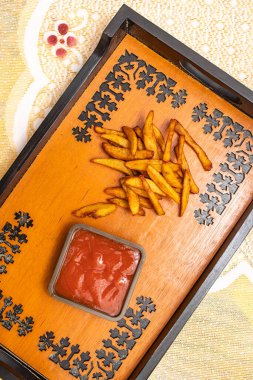 French Fries with Ketchup served on tray dish isolated on dinning table top view of bangladeshi fast food clipart