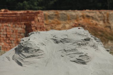 Piles of sand in the brick kiln