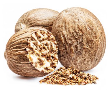 Whole nutmegs and grated nutmeg isolated on white background.