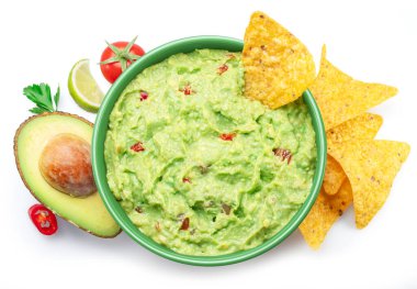 Guacamole sauce, its ingredients tortilla chips, popular Mexican food  top view on white background. clipart