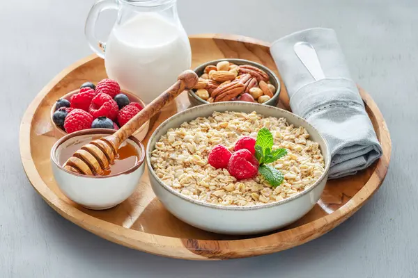 Bowl Porridge Oatmeal Different Ingredients Wooden Tray Breakfast Serving — Stock Photo, Image