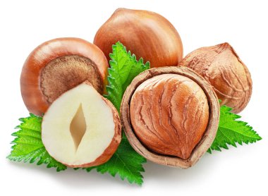 Hazelnuts, hazelnut kernel and green leaves on white background. Full depth of field. Clipping path. clipart