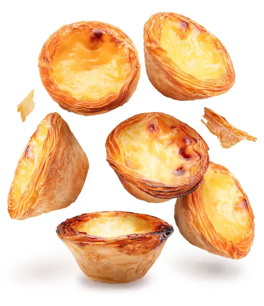 stock image Pastel de nata tarts levitating in air on white background. 