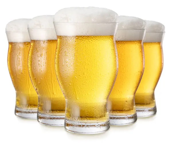 stock image Glasses of chilled light beer with large head of foam isolated on white background. Clipping path.