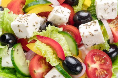 Greek salad  close up. Healthy food background. clipart