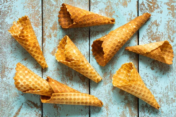 Wafer cones for ice cream on a blue background. Summer food concept.