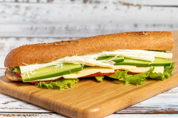 Baguette Sandwich Sandwich Olives Lettuce Tomato Cucumber Cheddar String Cheese — Stock Photo, Image