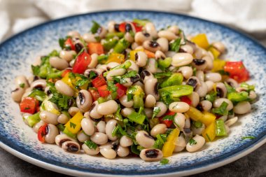 Dried cowpea salad on a dark background. Turkish cuisine appetizer flavors. close up clipart