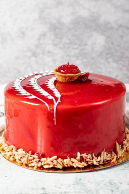 Raspberry cake. Celebration or birthday cake covered with raspberry on the outside and filled with forest fruits. Special design. close up