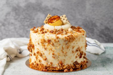 Honey and hazelnut cake on a stone background. Fruit and nut birthday cake. close up