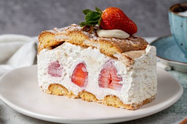 Strawberry and whipped cream cake. Strawberry and cream layer cake on plate. close up