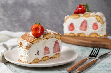 Strawberry and whipped cream cake. Strawberry and cream layer cake on plate. close up