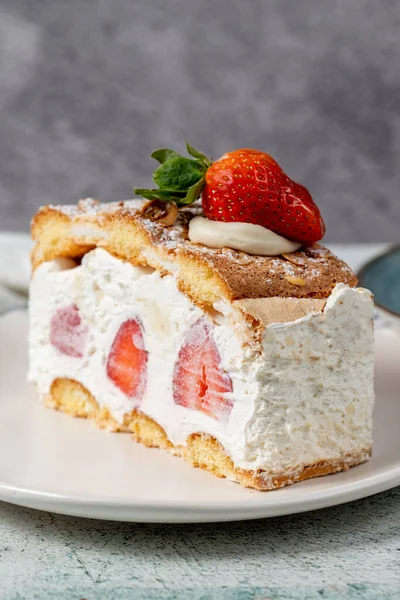 Strawberry and whipped cream cake. Strawberry and cream layer cake on plate. close up