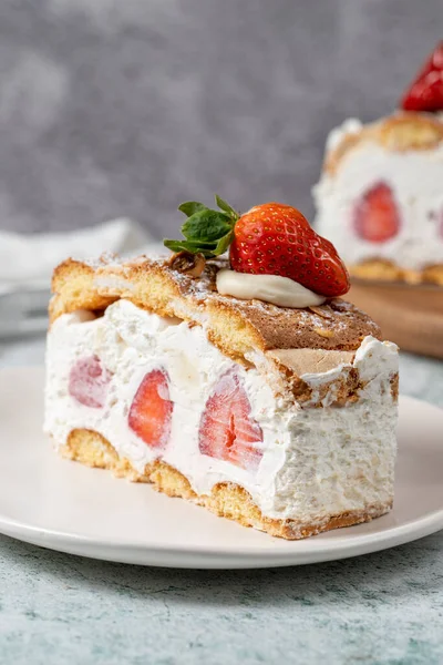 Strawberry and whipped cream cake. Strawberry and cream layer cake on plate. close up