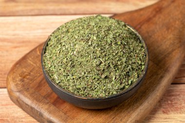 Dried mint spice. Dried mint leaves in bowl on rustic table. Dry spice concept