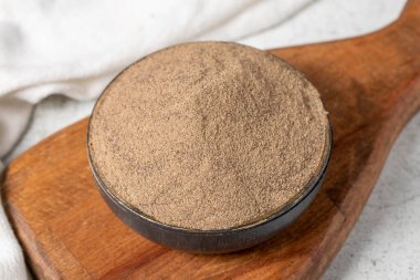 Black pepper spice. Ground black pepper spice on stone background. Dry spice concept. close up