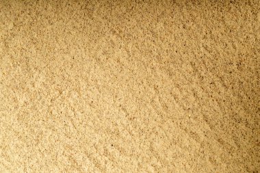 Powdered white pepper spice. Heaps of ground white peppercorns. Dry spice concept. close up